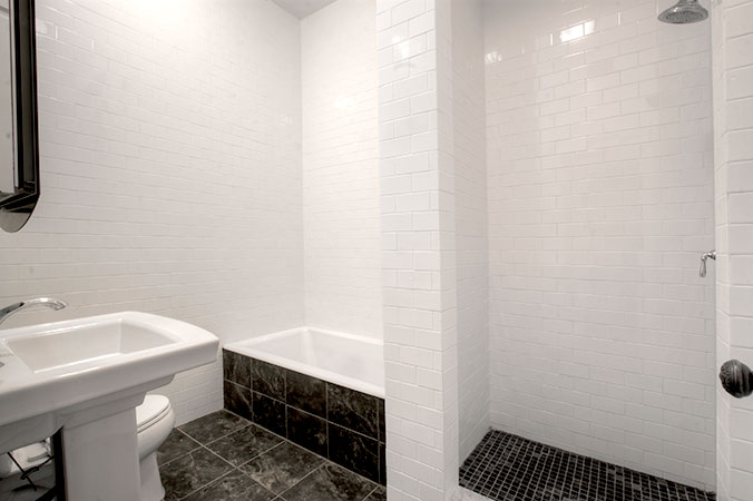 Bathroom with small tub and walk-in shower