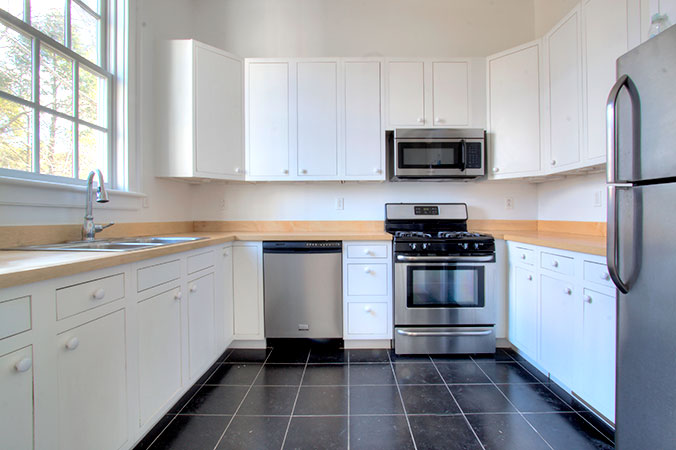 Kitchen with white cabinets and stainless steel appliances