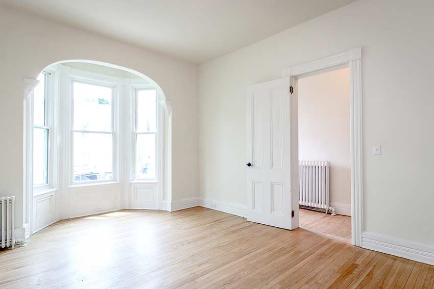 Refinished hardwood oak floors in the light filled living room and foyer.