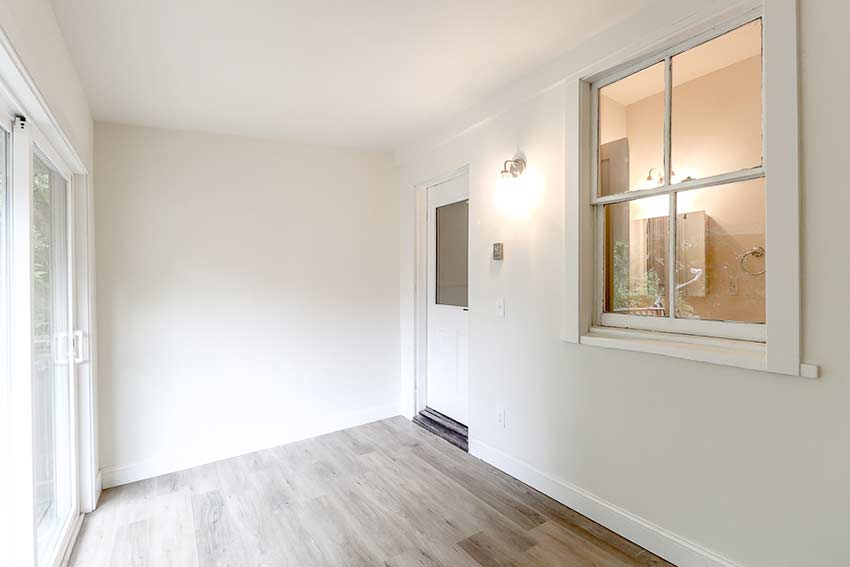 Additional back room with a sliding glass door leading to the back porch.