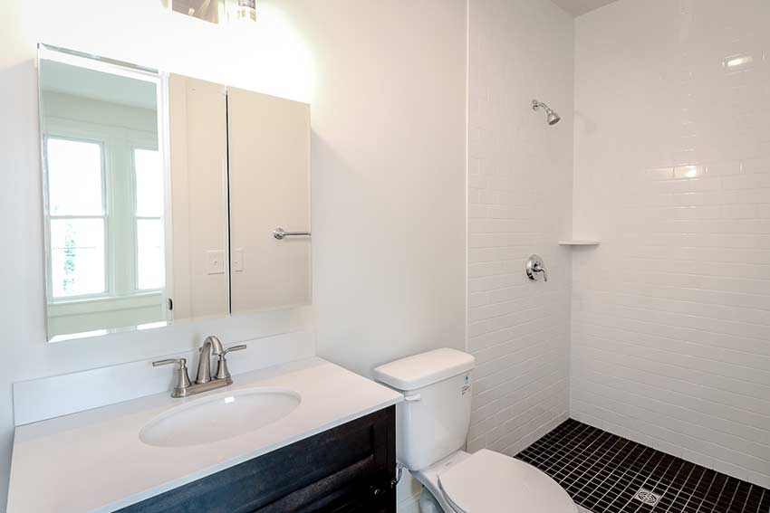 Second new bathroom with tiled shower on the second floor.