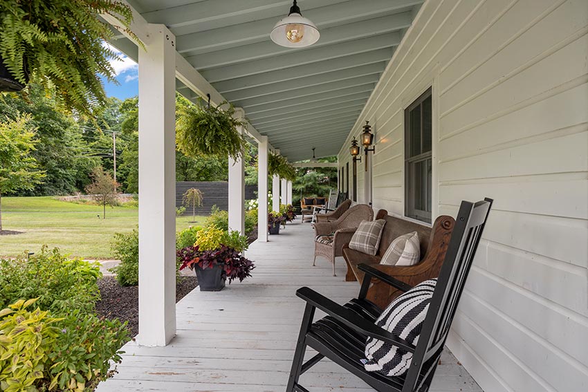 A rocking chair porch that spans the entire front of the house