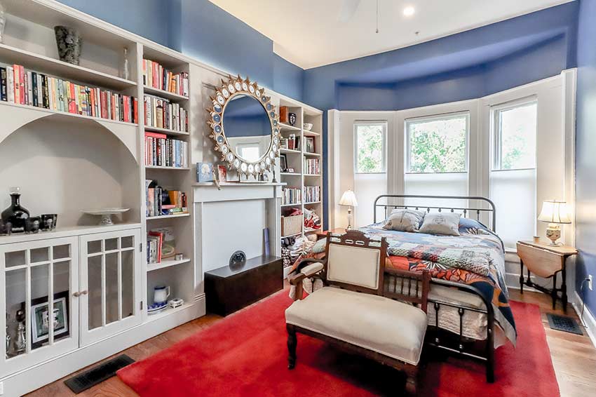 Bedroom on second floor with built-in bookcases.