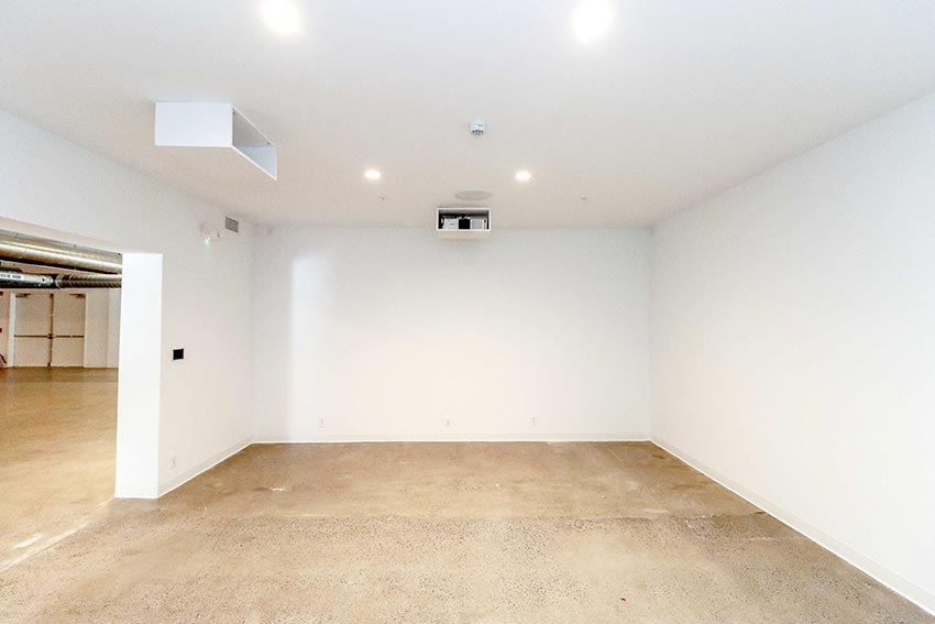 Open room with polished concrete floors.