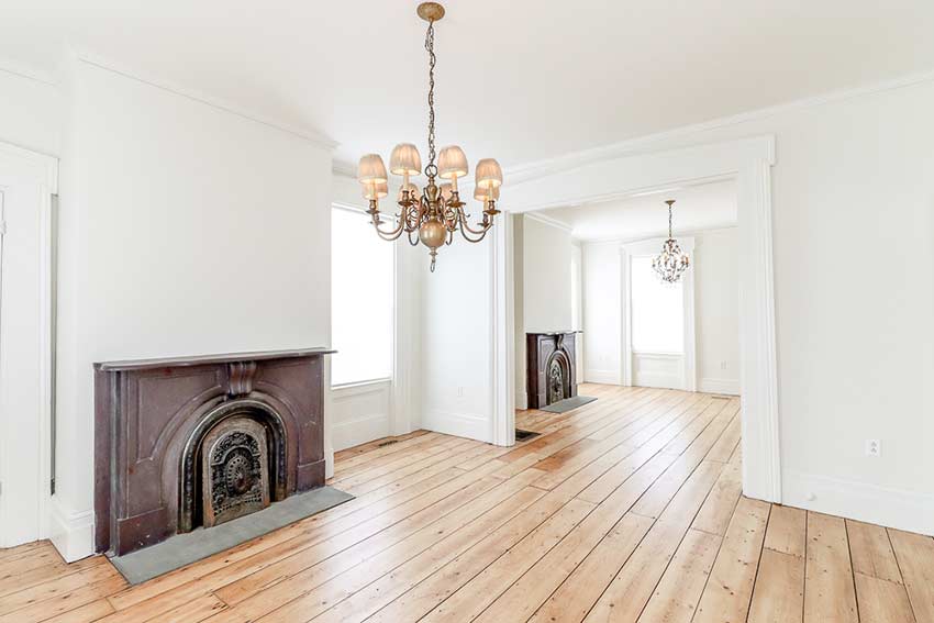 Two large parlors each with cast-iron & stone fireplaces.