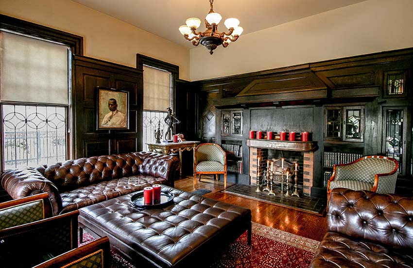 Living room with fireplace and dark decorative woodwork