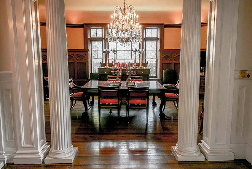 Formal oak dining room with crystal chandelier