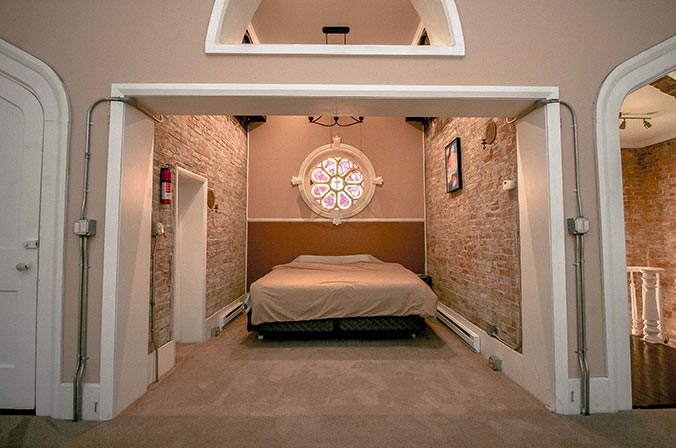 Bedroom with original circular stained glass window