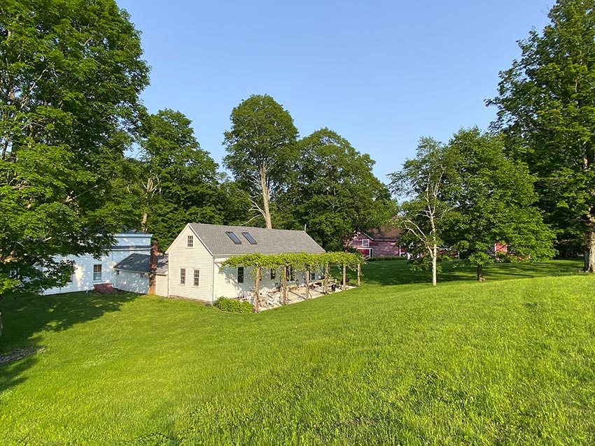 An 1850 Historic farmhouse rear view of house and back yard